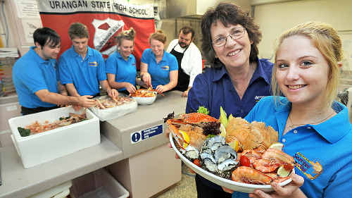 Elaine Lewthwaite and Katie-May Dudley with one of the seafood platters that Urangan State High School students Rohan Hook (left), Jeff Garton, Tiffany Sneddon, Kimberlea Shorten and tutor Damien Symes have prepared ahead of Sunday’s Seafood Festival. Elaine Lewthwaite and Katie-May Dudley with one of the seafood platters that Urangan State High School students Rohan Hook (left), Jeff Garton, Tiffany Sneddon, Kimberlea Shorten and tutor Damien Symes have prepared ahead of Sunday’s Seafood Festival.